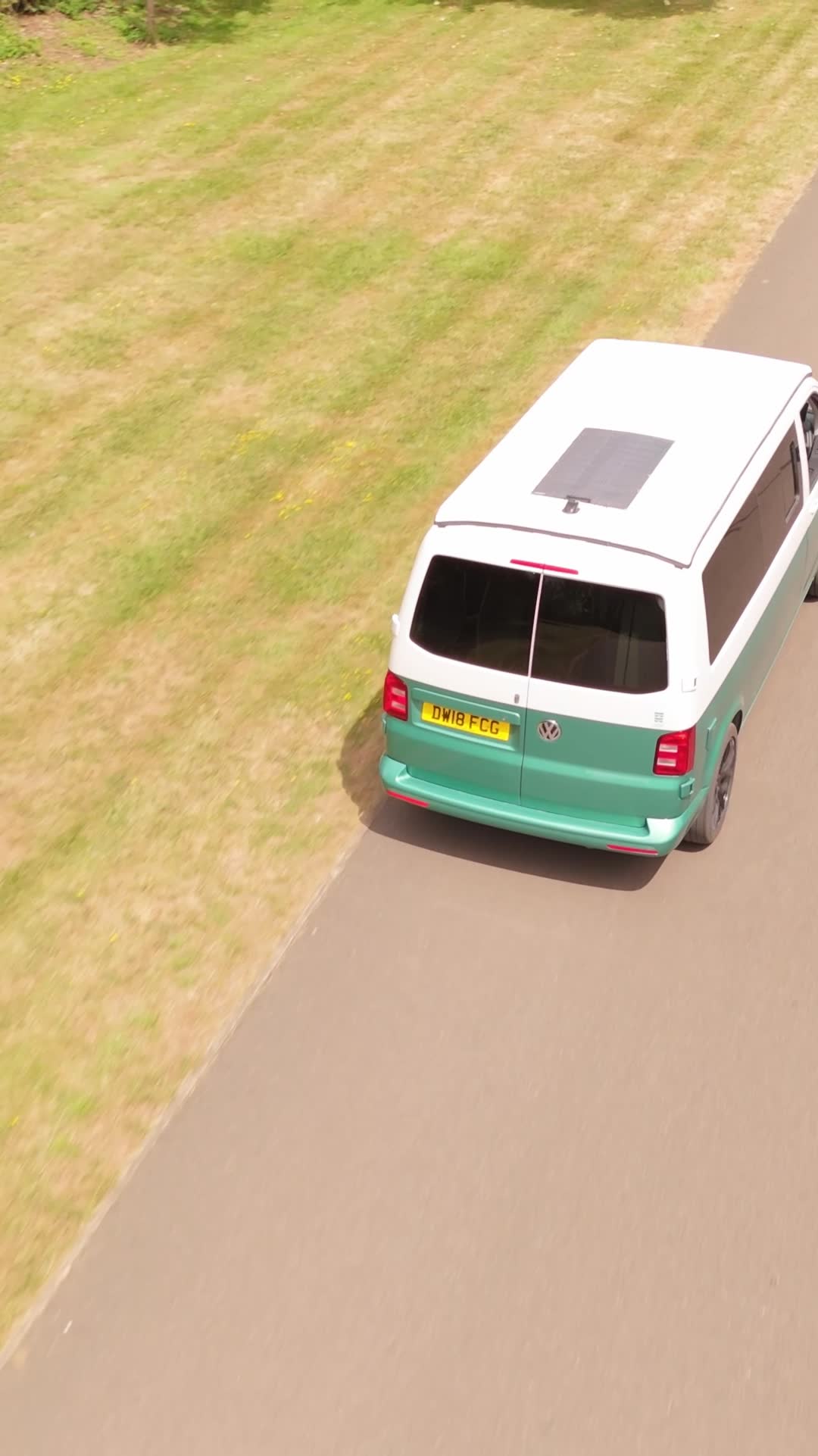 HubDub Campers: handbuilt VW campervan, aerial view on a tree-lined park road